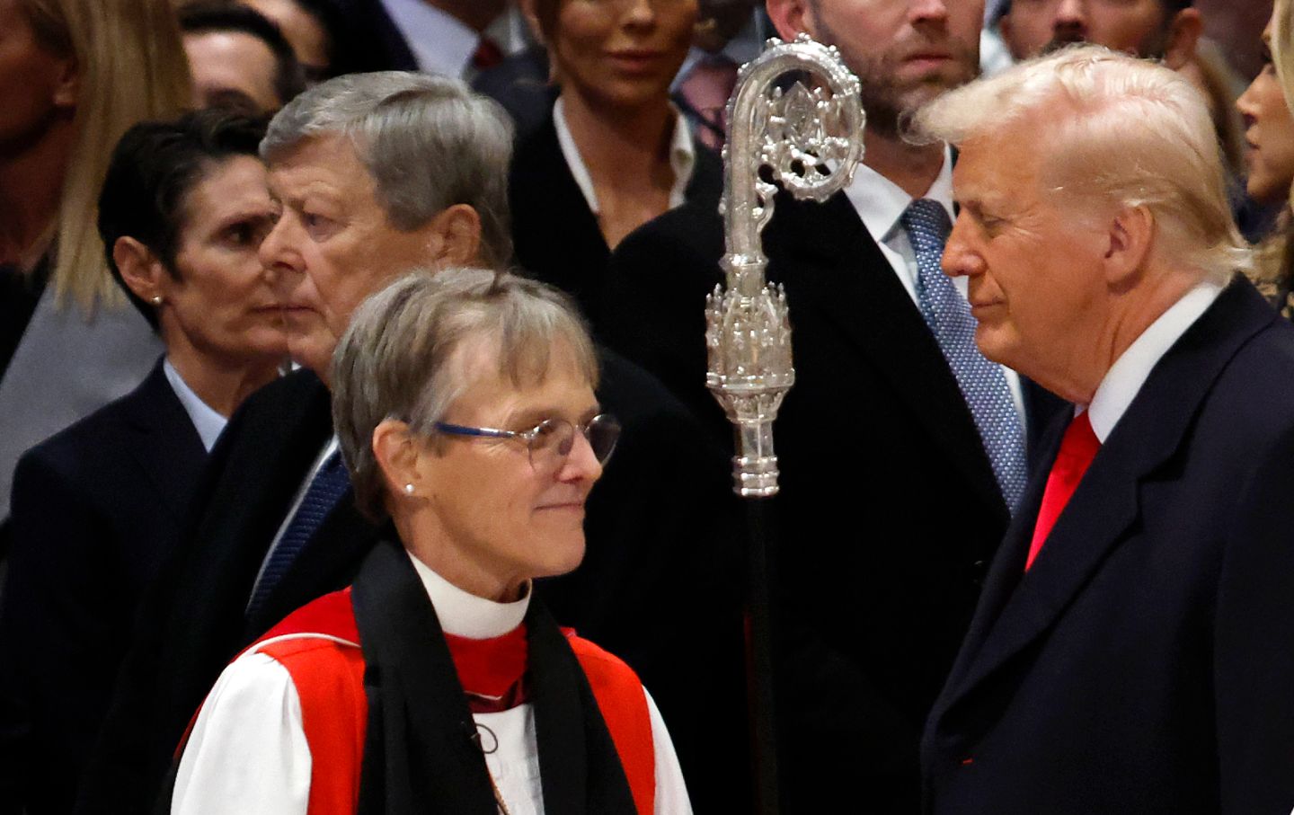 Bishop Mariann Edgar Budde arrives as US President Donald Trump looks on during the National Prayer Service at Washington National Cathedral on January 21, 2025.