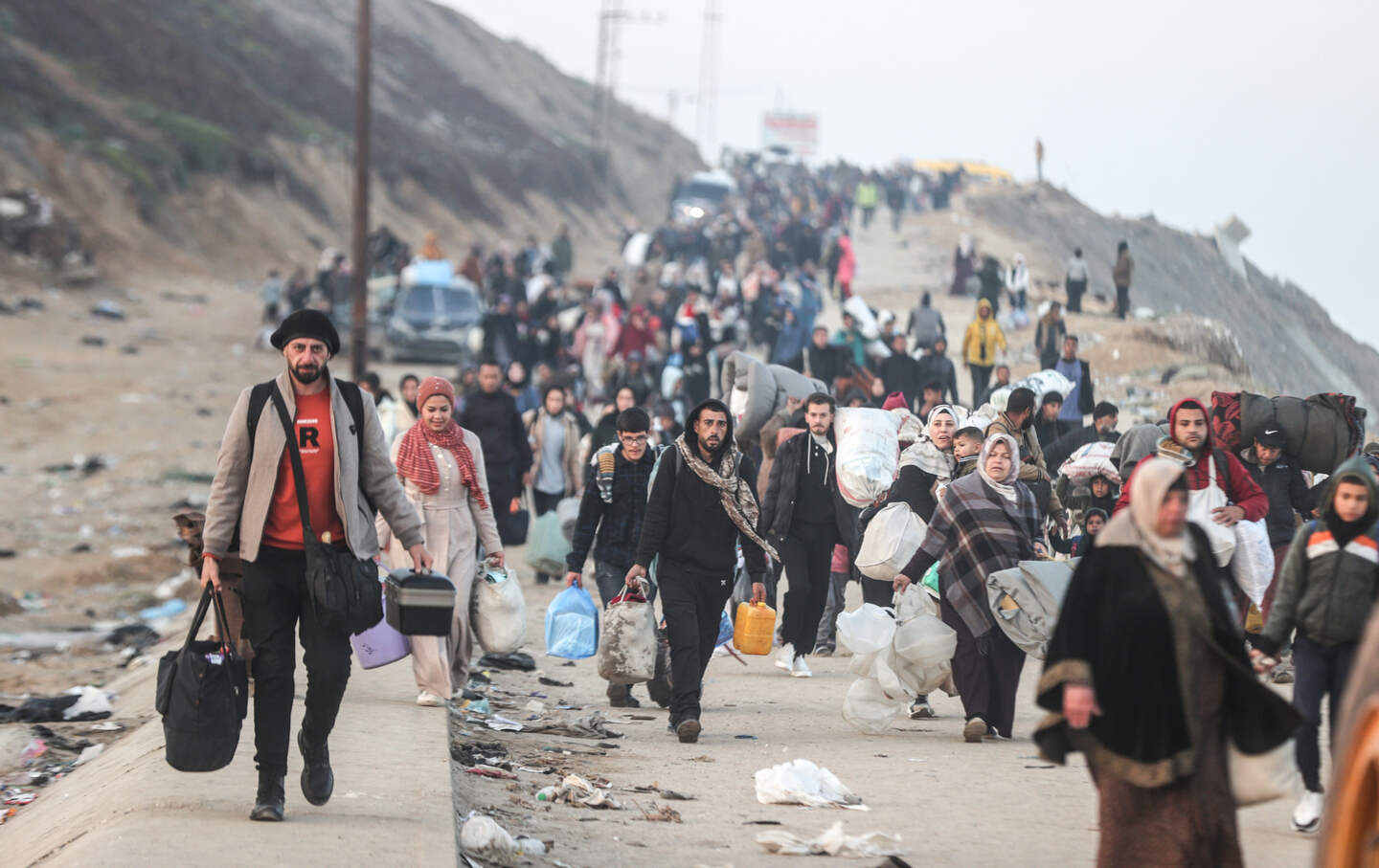 Displaced Palestinians making their way back on foot from the southern regions to their homes in the north via Al Rashid Road after the ceasefire agreement in Gaza Strip on January 28, 2025.