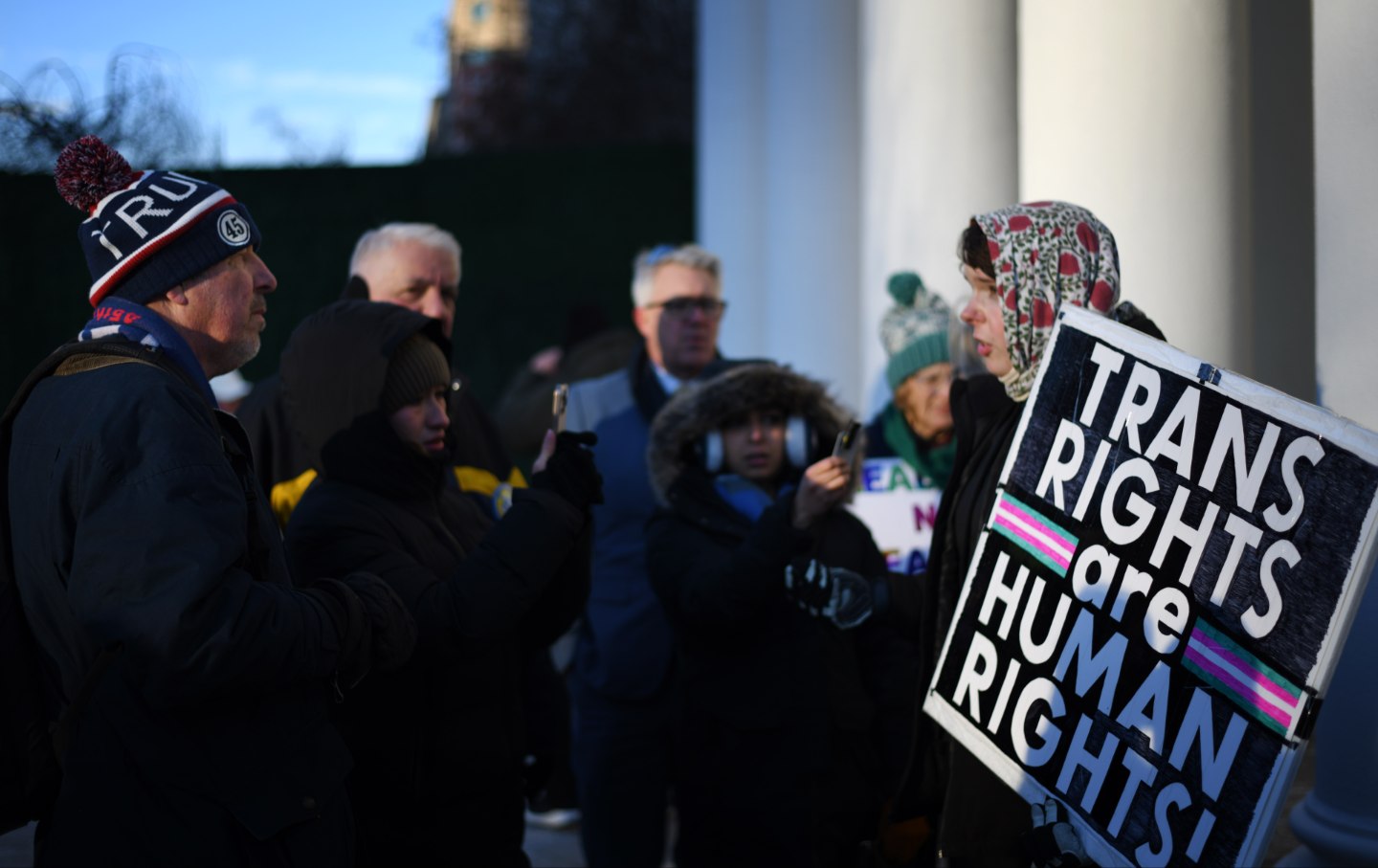 Trans rights activists and President Trump supporters near the White House on January 20, 2025.