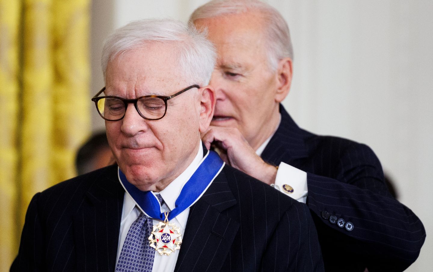 David Rubenstein, founder of The Carlyle Group, receives the Presidential Medal of Freedom from President Joe Biden in the East Room of the White House on January 4, 2025.