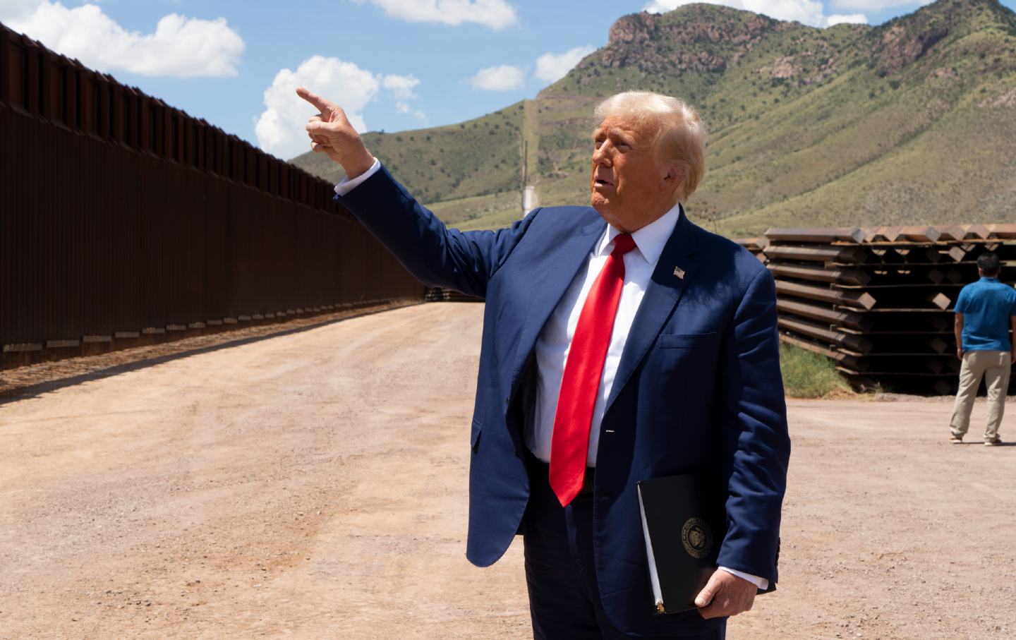 Then-candidate Donald Trump walks along the US-Mexico border south of Sierra Vista, Arizona, on August 22, 2024.