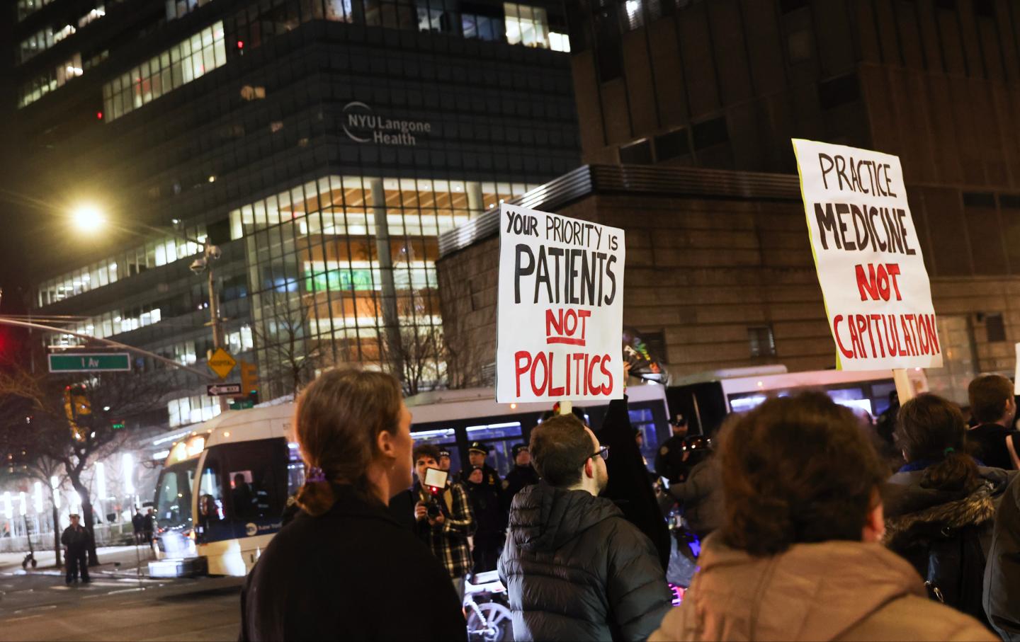 People march past NYU Langone Health during a rally demanding that NYU Langone commit to providing gender-affirming care for transgender youth, Monday, Feb. 3, 2025, in New York.