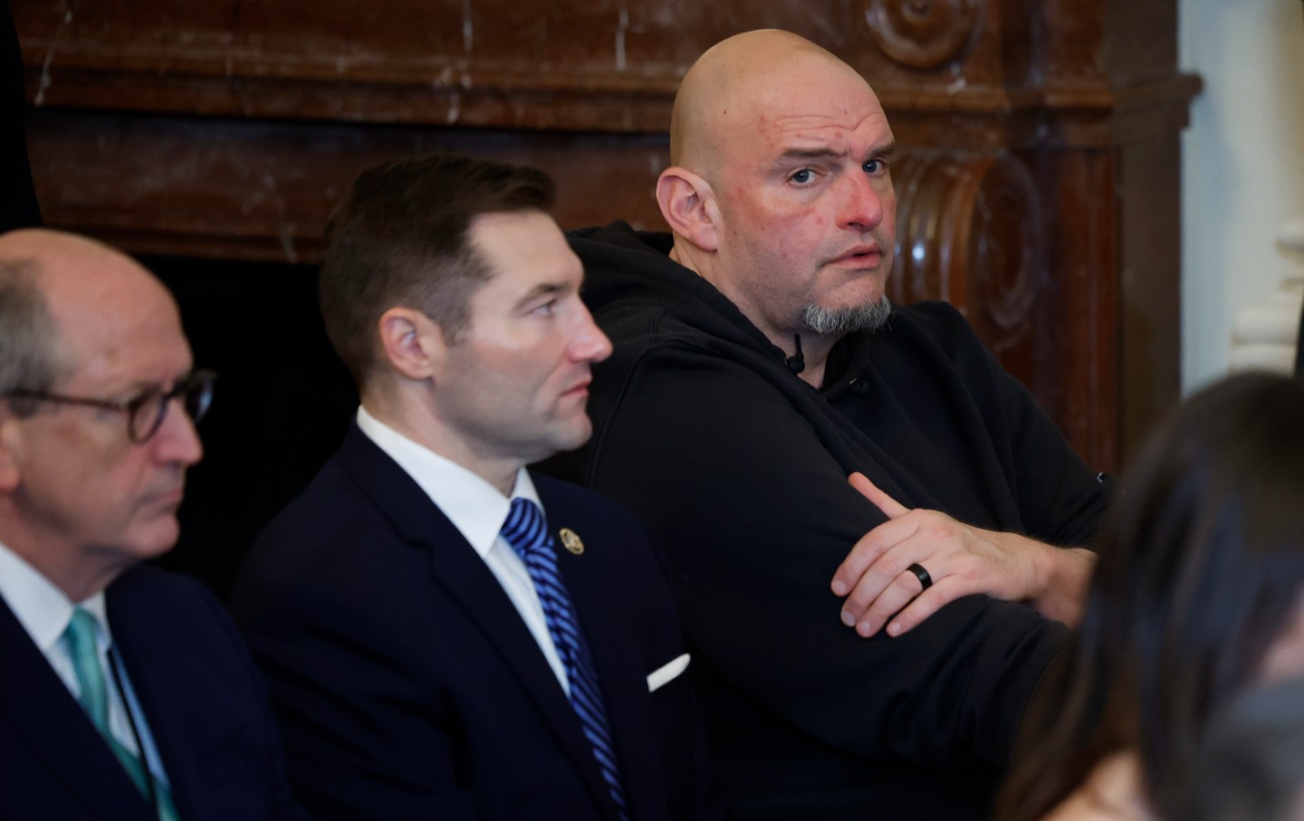 Senator John Fetterman (D-PA) (C) joins other lawmakers for the signing ceremony for the Laken Riley Act