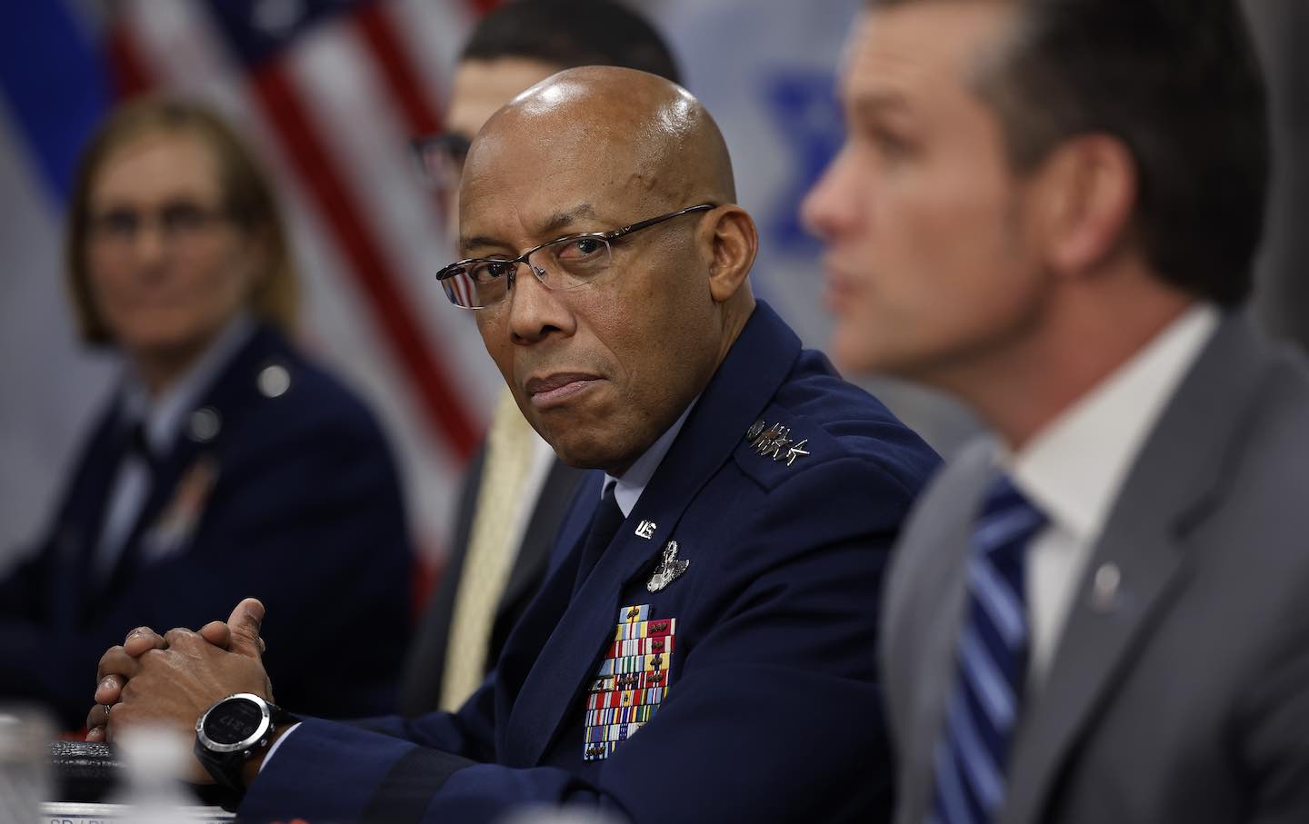 Chairman of the Joint Chiefs of Staff General Charles Brown Jr. listens to US Secretary of Defense Pete Hegseth answer reporters' questions on February 5, 2025, in Arlington, Virginia.