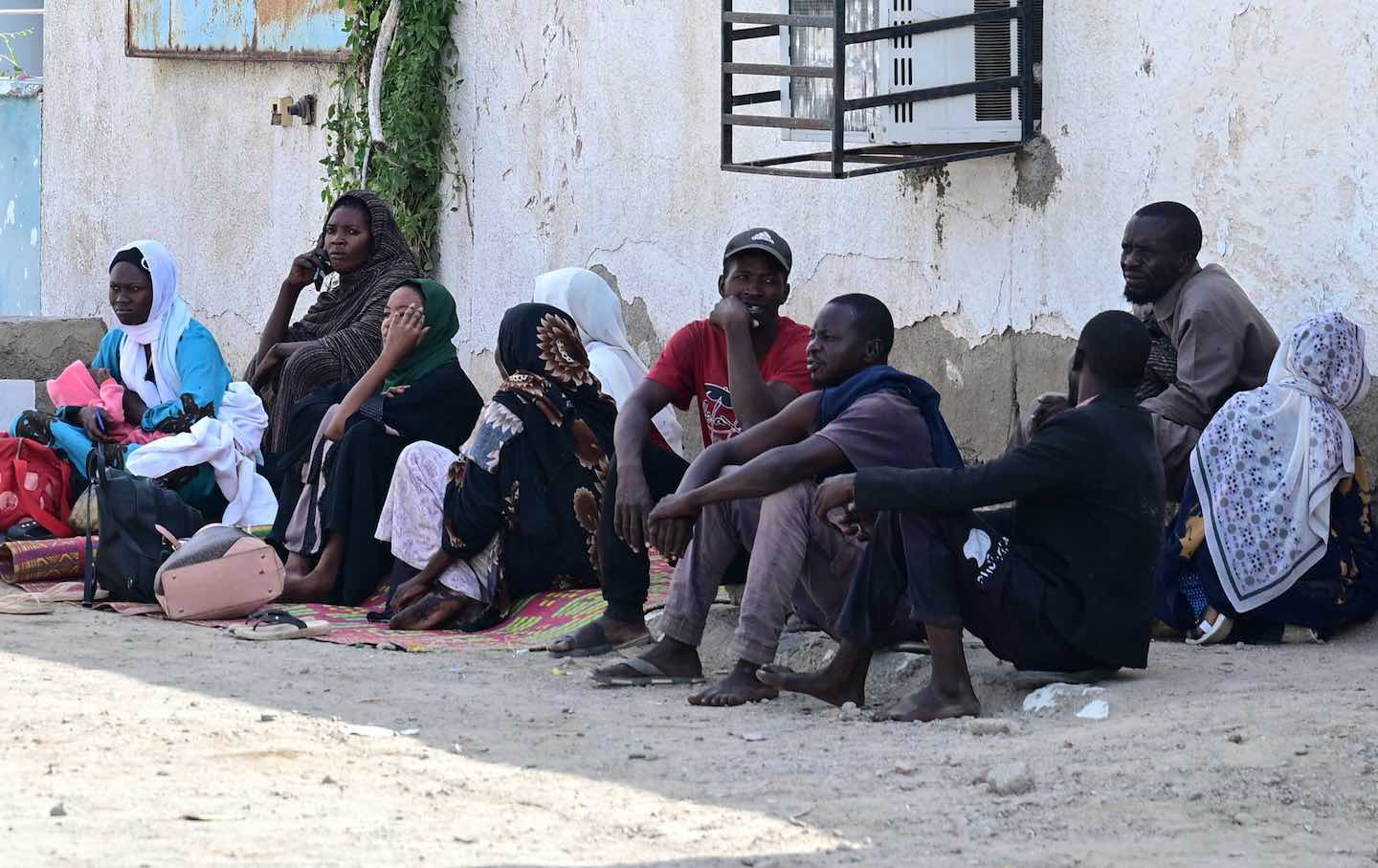 Displaced Sudanese wait for buses transporting people on February 10, 2025, from Port Sudan to the Jazira state, which was retaken by the Sudanese army from the Rapid Support Forces (RSF) paramilitaries last month.