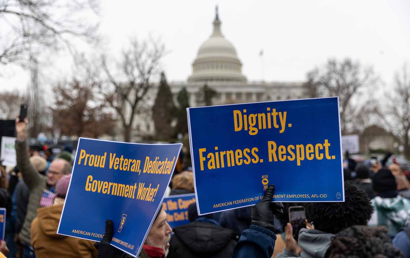 Members of the American Federation of Government Employees protest against firings during a rally to defend federal workers in Washington, DC, on February 11, 2025.