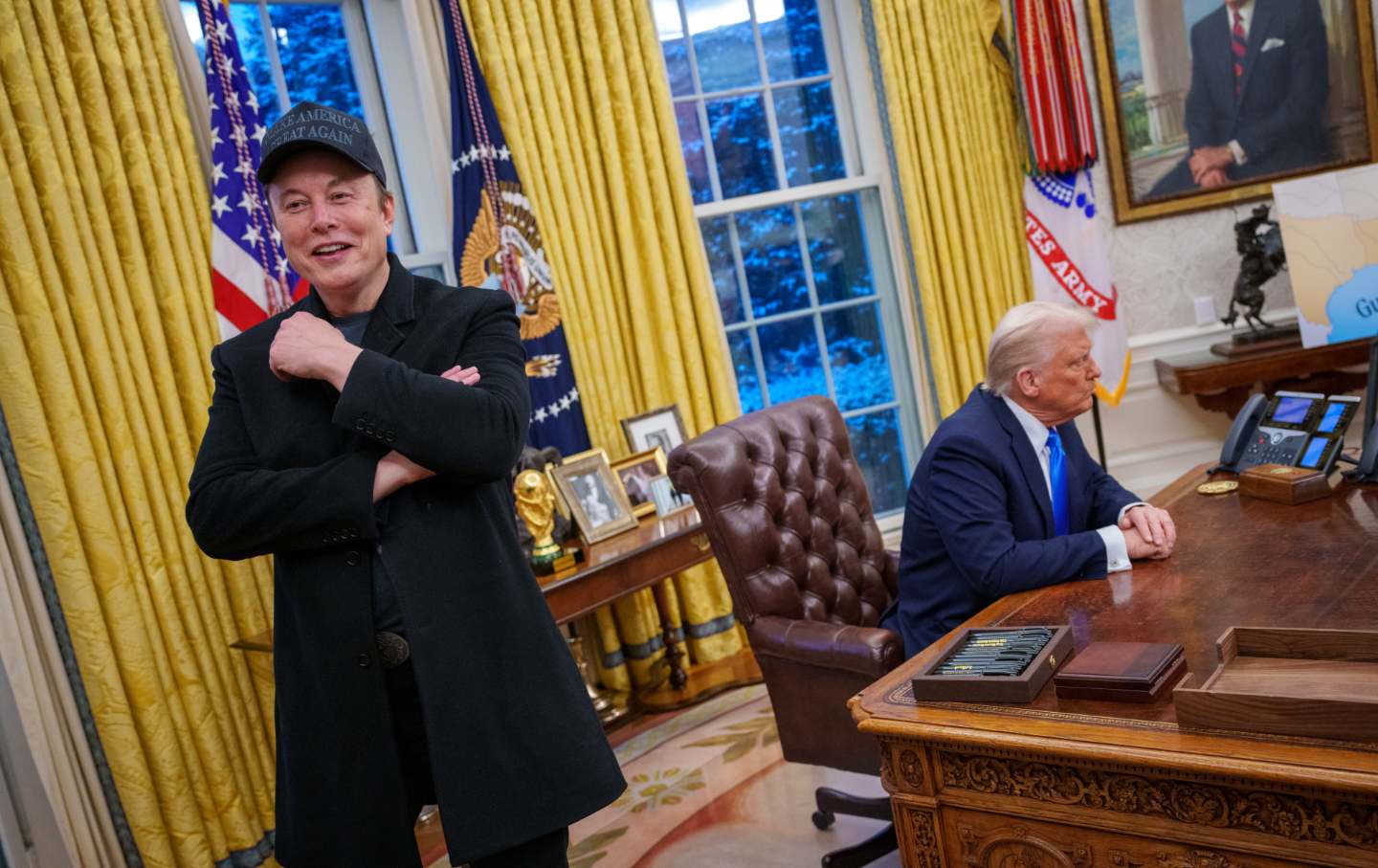 Elon Musk and U.S. President Donald Trump appear during an executive order signing in the Oval Office at the White House on February 11, 2025