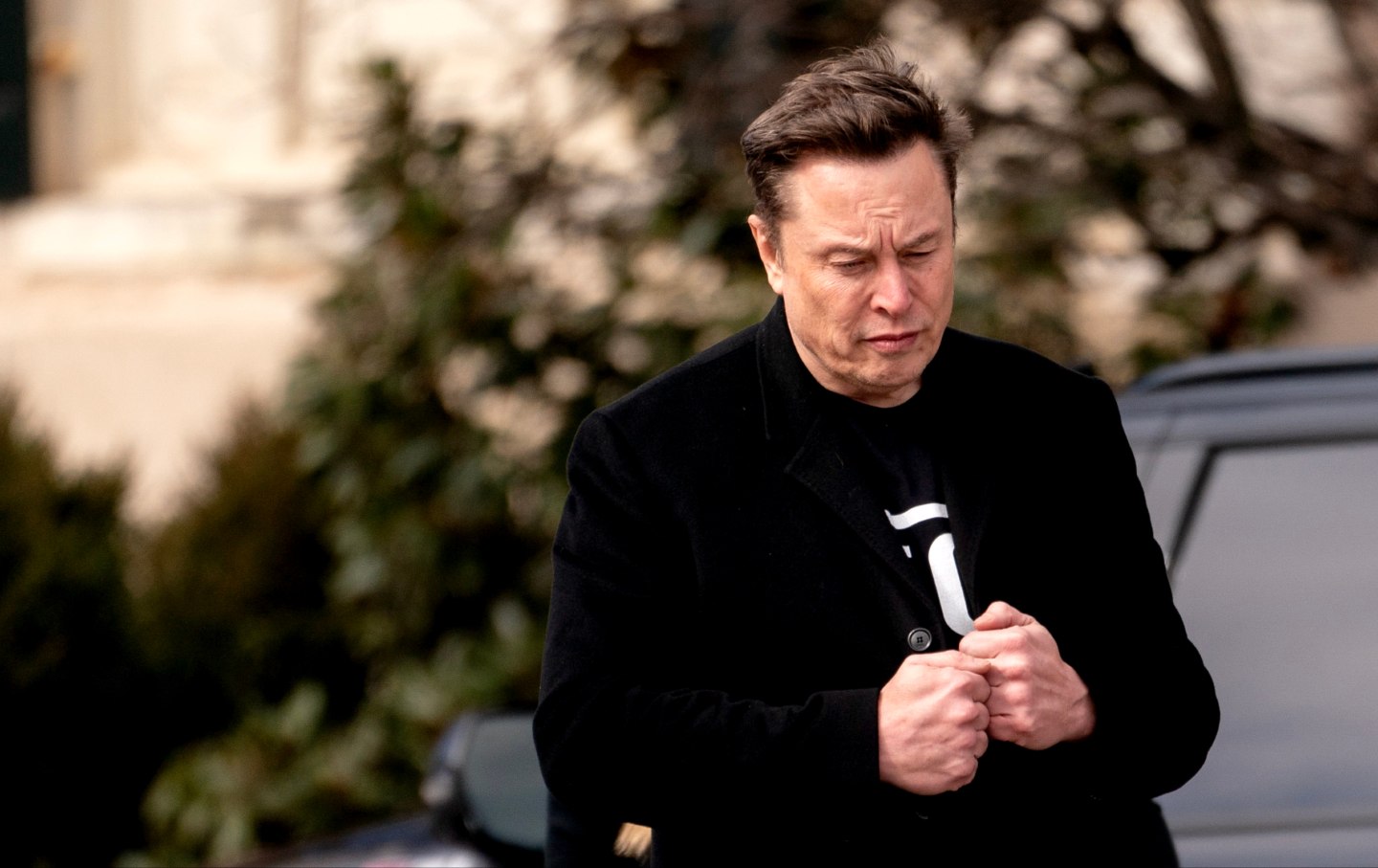 Elon Musk walks to the Eisenhower Executive Office Building near the White House in Washington, DC, on Thursday, February 13, 2025.