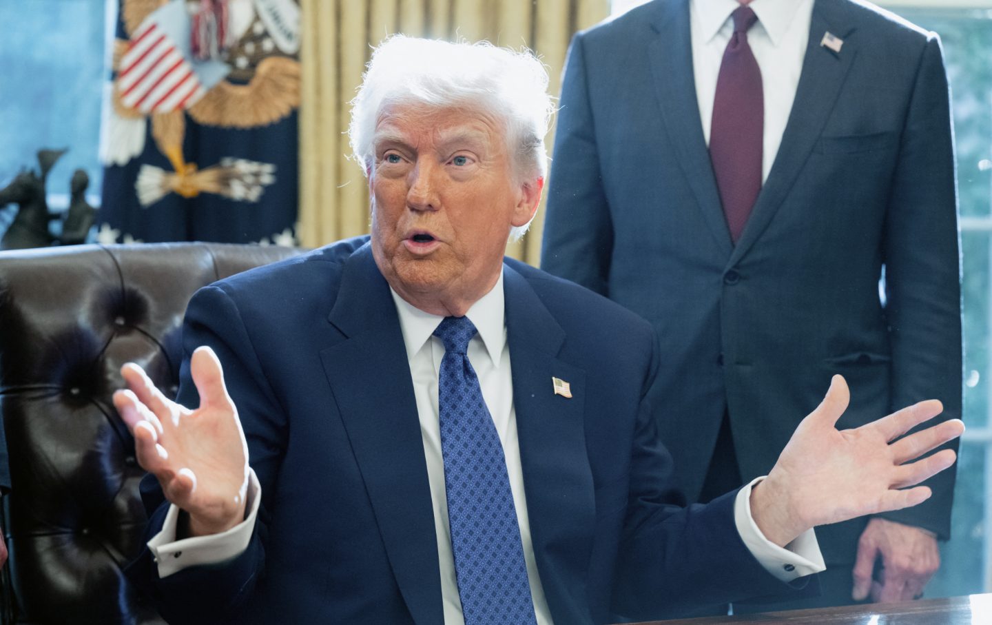 Donald Trump speaks after signing an executive order on halting federal funds for schools and universities that impose coronavirus vaccine mandates in the Oval Office of the White House in Washington, DC, on February 14, 2025.