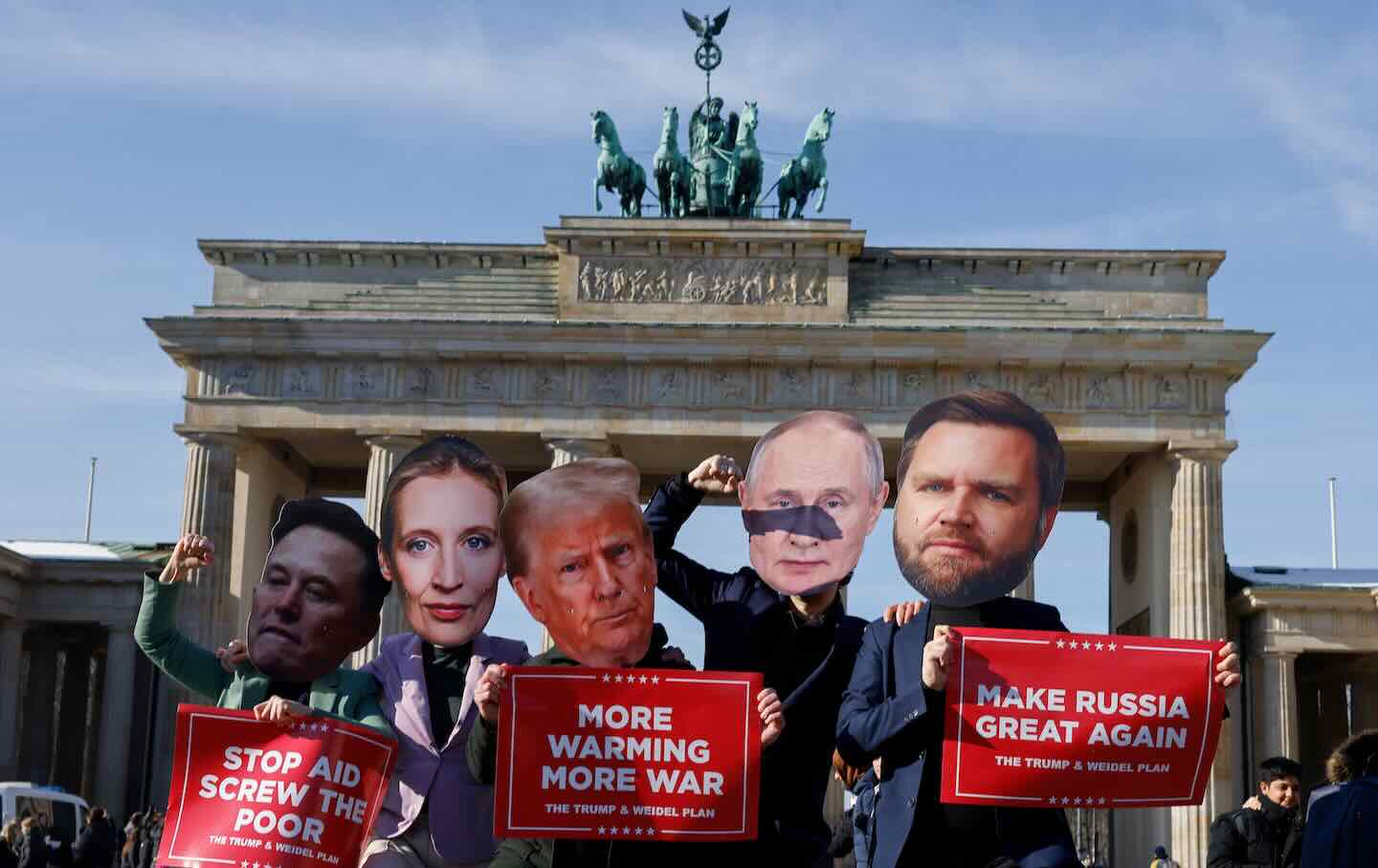 Activists wearing masks of (L-R) Tesla and SpaceX CEO Elon Musk, Co-leader and main candidate of the far-right Alternative for Germany (AfD) party Alice Weidel, US President Donald Trump, Russian President Vladimir Putin, and US Vice President JD Vance, hold up placards which read “Stop Aid, Screw the poor,” “More Warming More War,” and “Make Russia Great Again” as they stage a protest against the perceived support of the US and Russia for the far-right AfD party in front of the landmark Brandenburg Gate in Berlin, on February 20, 2025, ahead of the upcoming German elections on February 23.