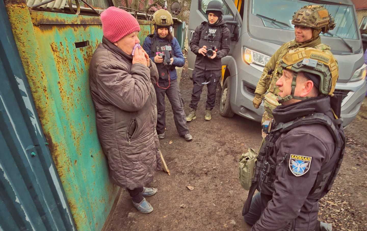 Leonid “Chaplan” Numerchuk gets on his knees to beg a woman to evacuate from the embattled Ukrainian city of Pokrovsk in late January. She had requested an evacuation, but changed her mind when rescuers arrived, and ultimately stayed in her home.