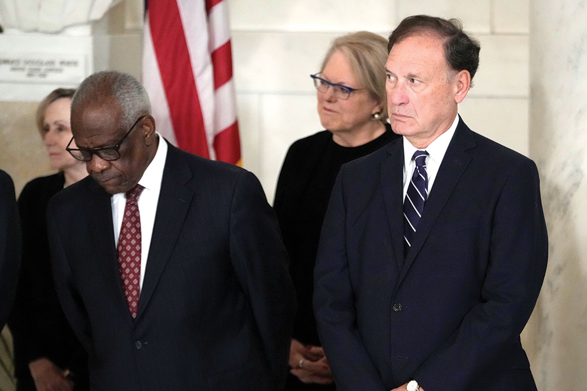 Supreme Court Justice Clarence Thomas and Justice Samuel Alito attend a private event together.