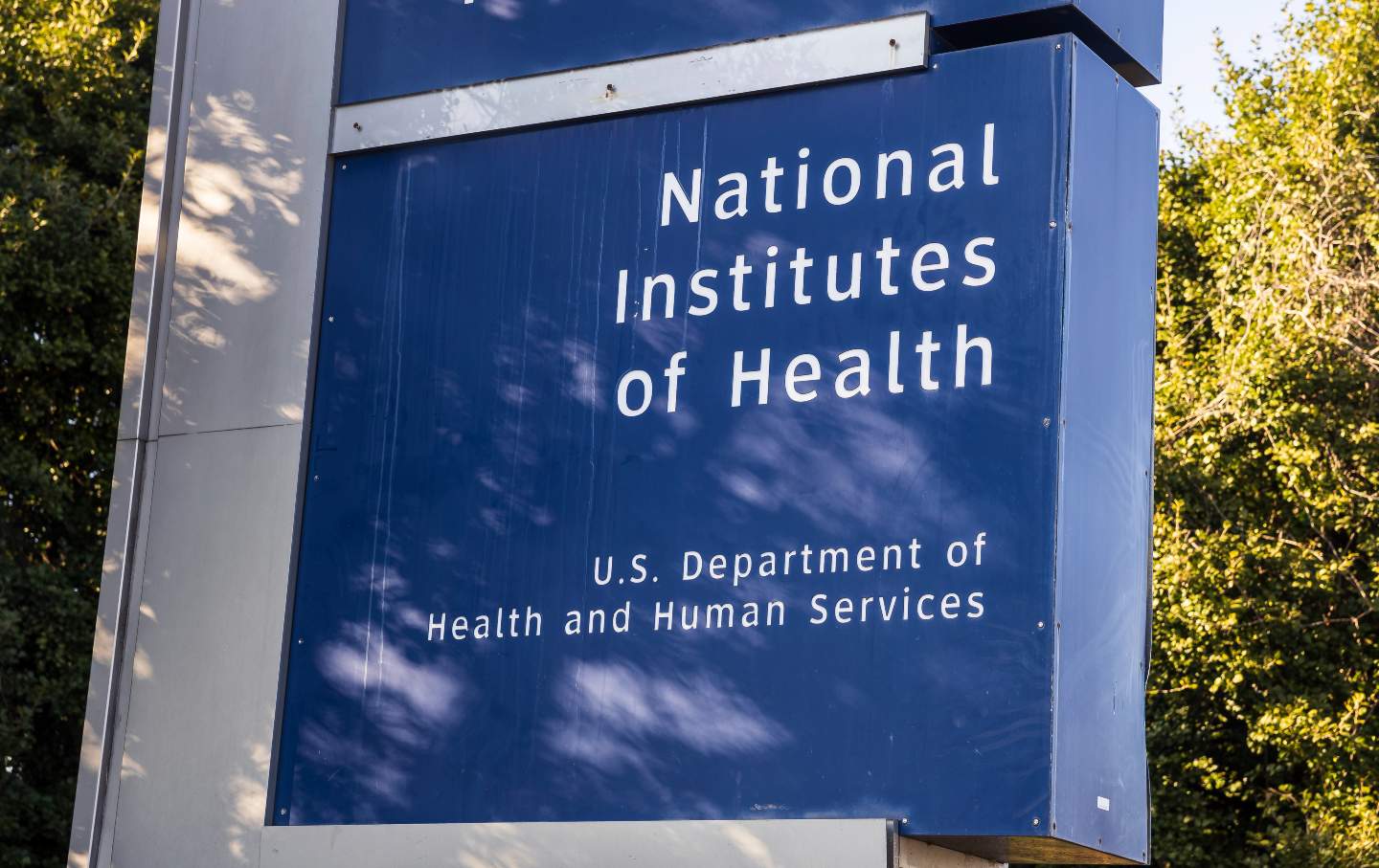 A sign is seen outside National Institutes of Health headquarters in Bethesda, Maryland.