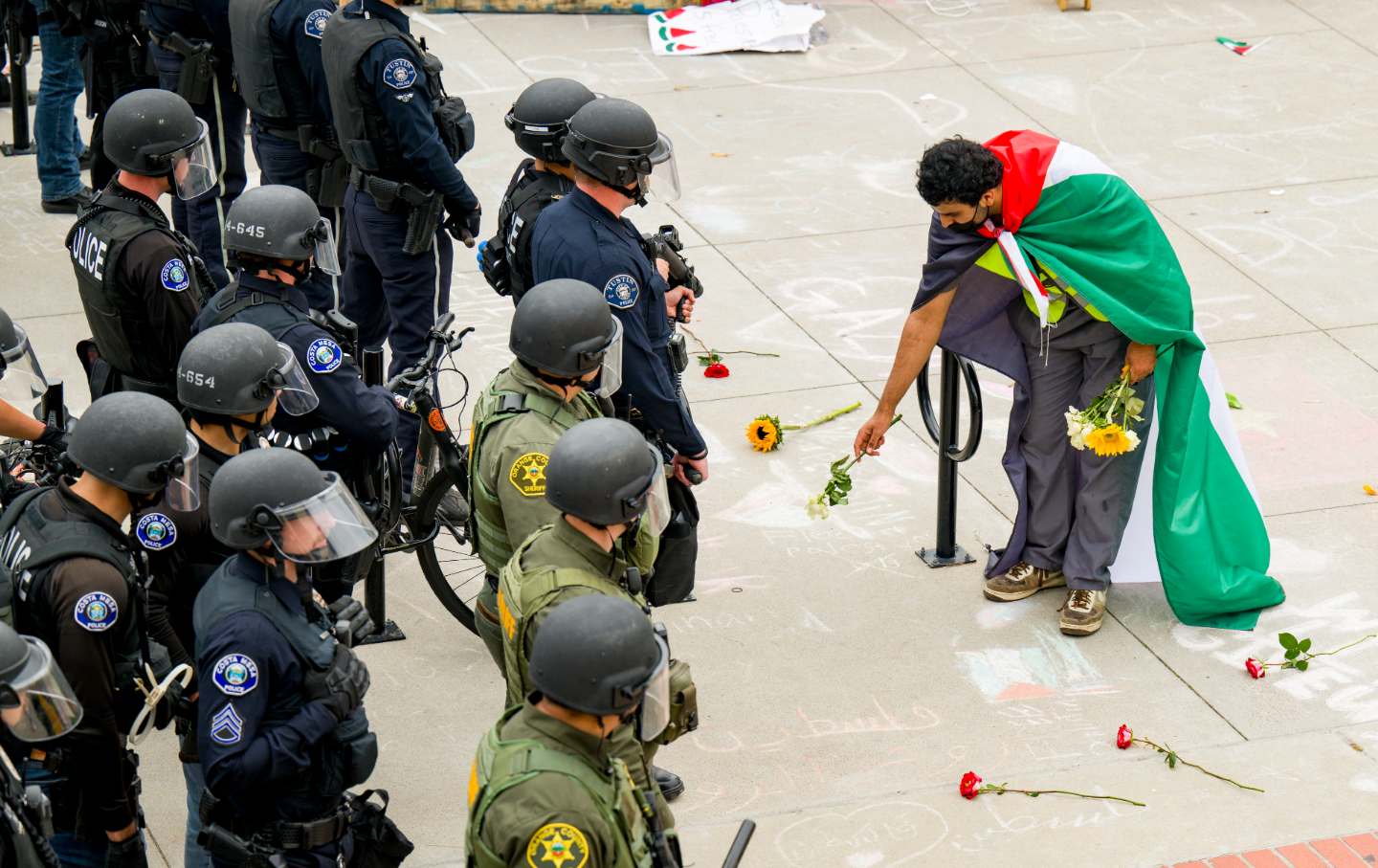 A supporter of the pro-Palestinian encampment at UC Irvine in May 2024.