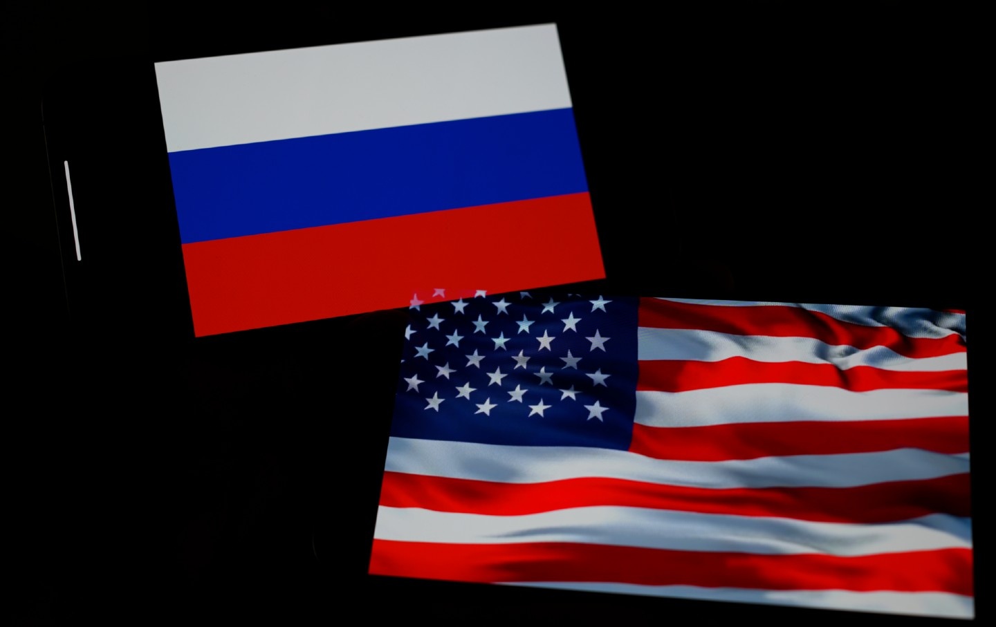 An illustration of Russian and US flags, photographed in Warsaw, Poland, on February 16, 2025.