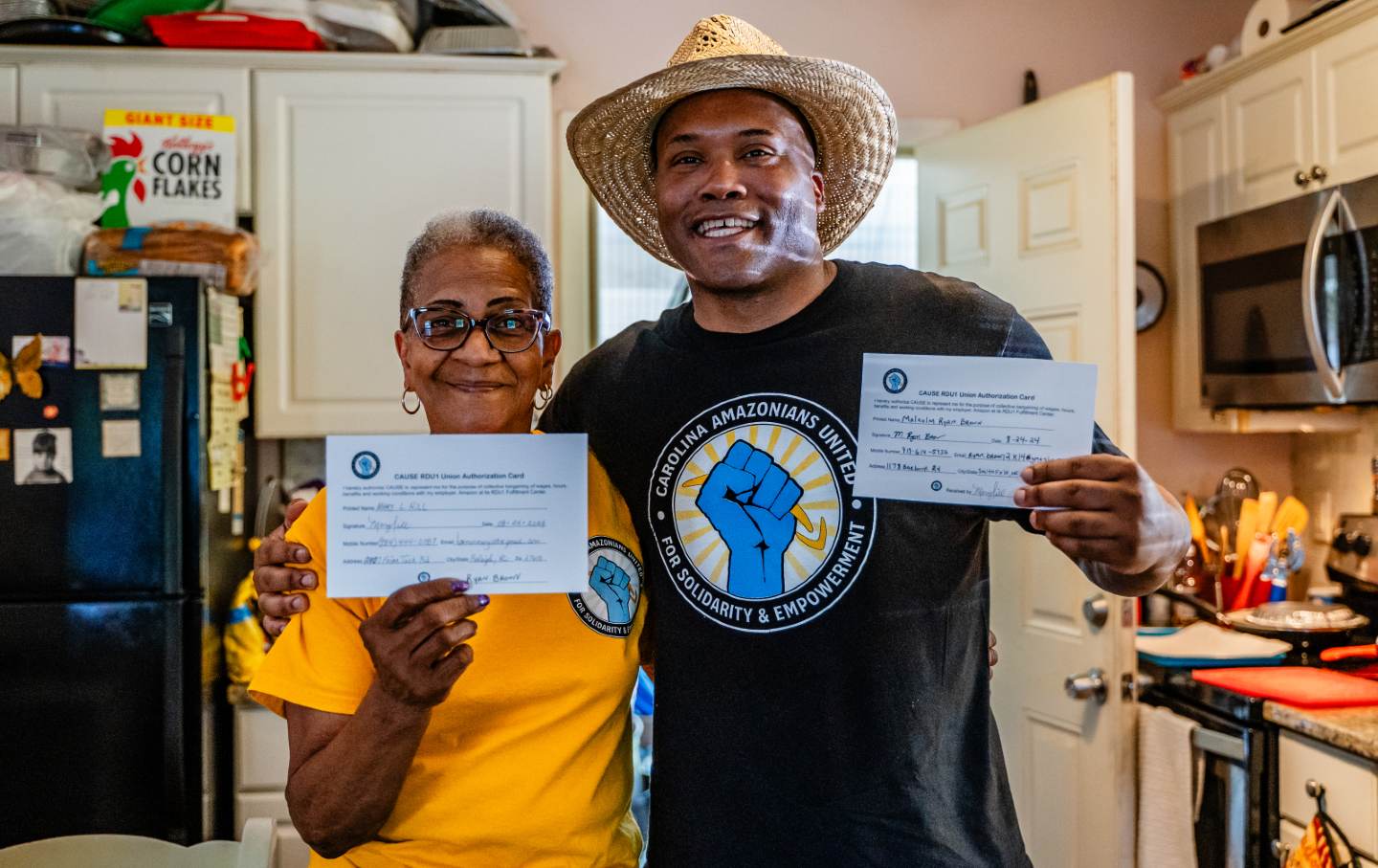 The Rev. Ryan Brown and Mary “Ma Mary” Hill show their signed union cards on September 2, 2024.