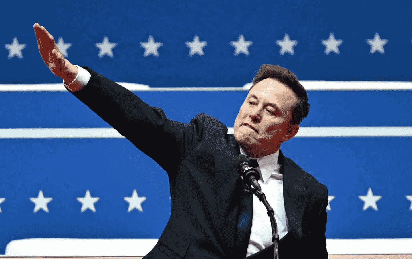 Tesla and SpaceX CEO Elon Musk are making a gesture when speaking at the first parade held in Washington, DC on January 20, 2025.