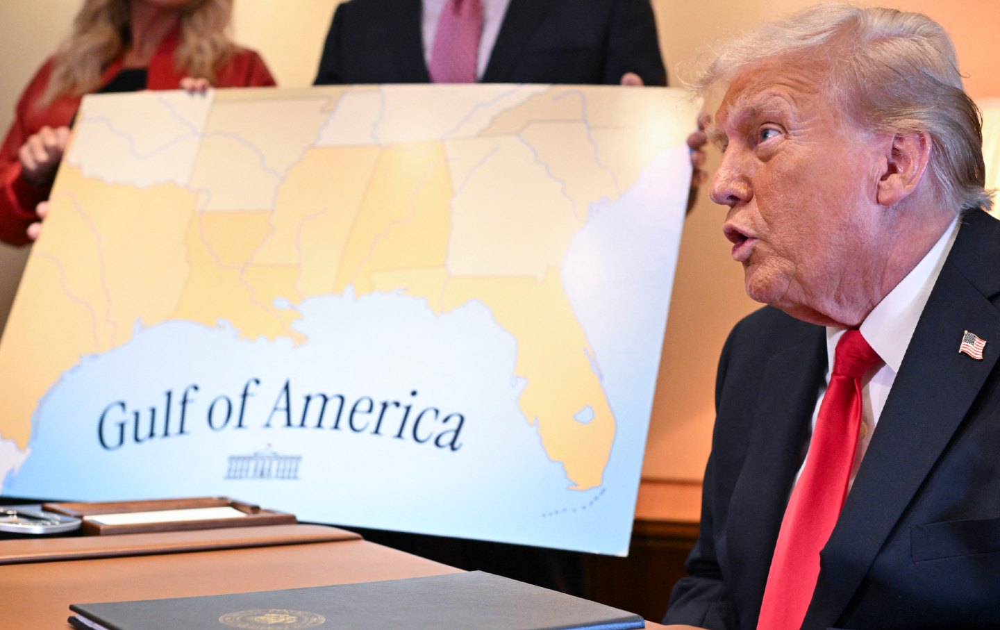 President Donald Trump speaks to the press after signing a proclamation renaming the Gulf of Mexico as the Gulf of America aboard Air Force One, as it flies over the Gulf en route to New Orleans on February 9, 2025.