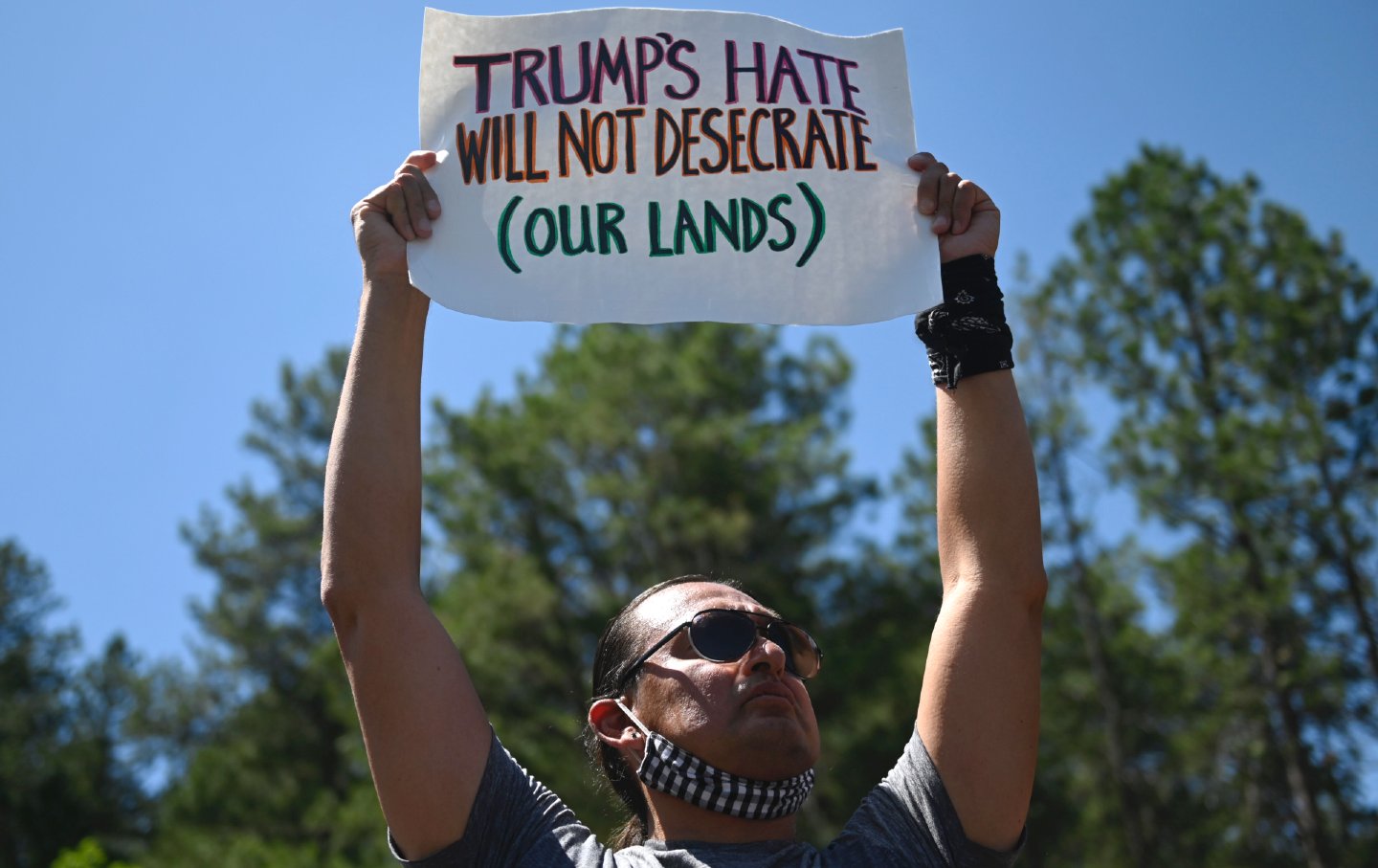 Activists and members of different tribes from the region protest in Keystone, South Dakota, on July 3, 2020, as they demonstrate around the Mount Rushmore National Monument and the visit of President Donald Trump.