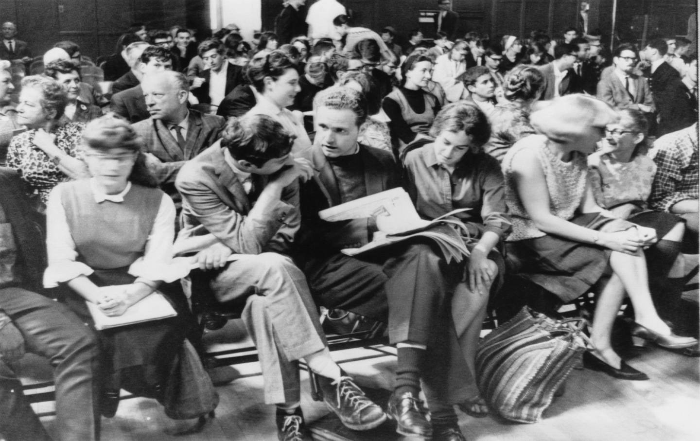 Mario Savio, a leader of the University of California Free Speech Movement, center, with Jack Weinberg and Susan Goldberg and other arrested demonstrators during their trial, Berkeley, California, 1965.