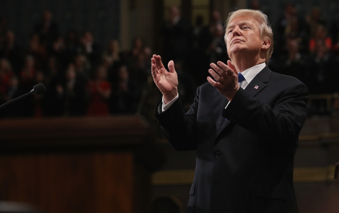 Donald Trump applauds while delivering a State of the Union address to a joint session of Congress at the US Capitol in 2018.