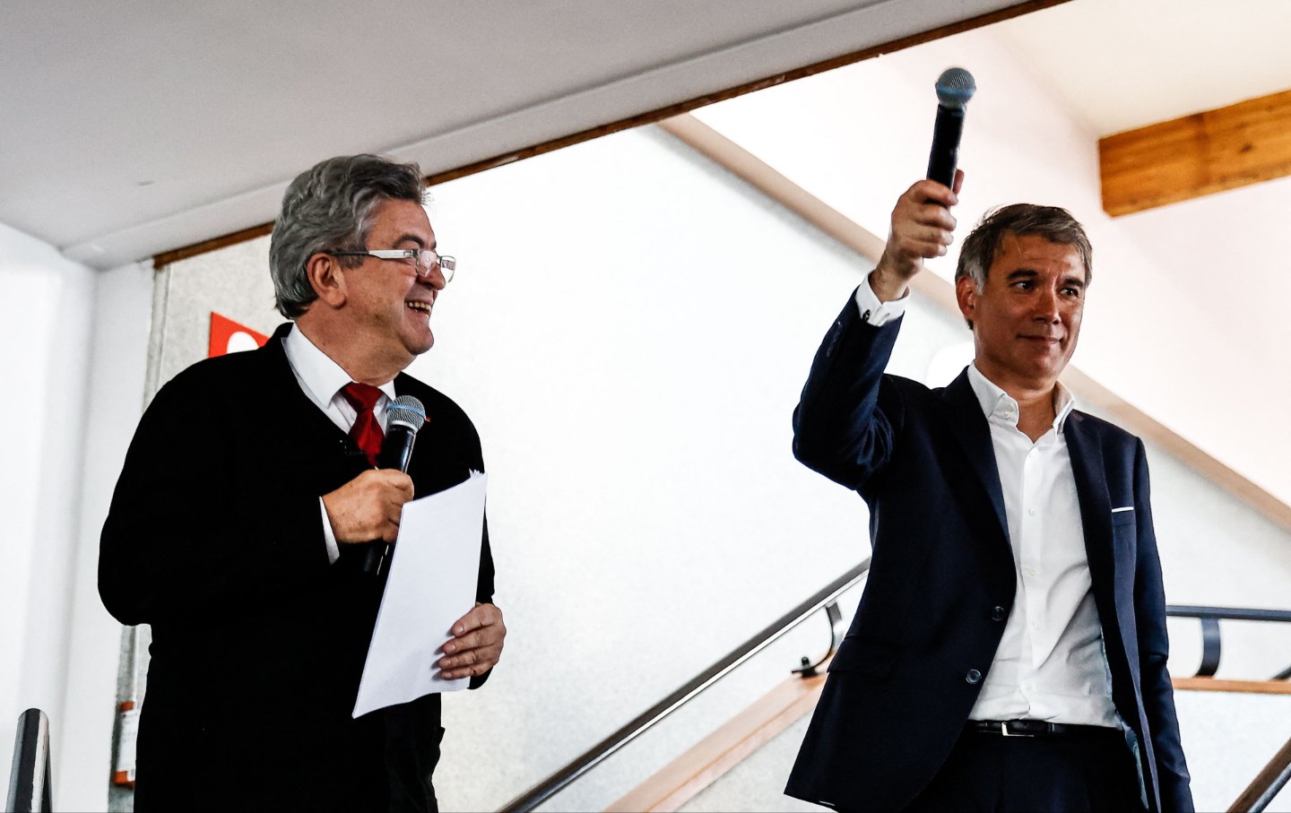 La France Insoumise party leader Jean-Luc Melenchon (L) and Parti Socialiste first secretary Olivier Faure address supporters during a campaign meeting in Caen, France, on June 8, 2022.