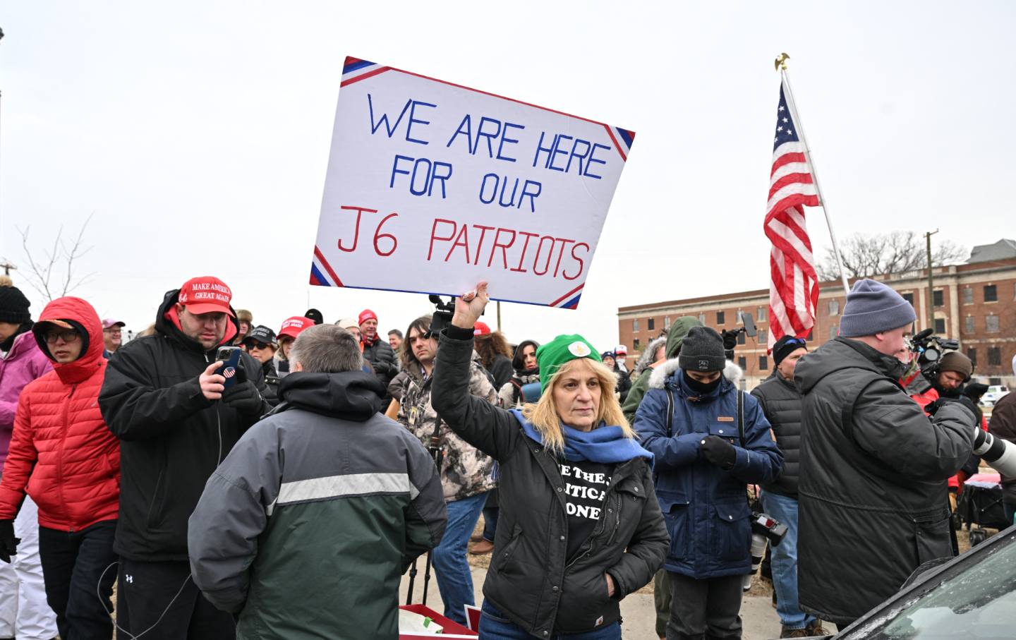 Sandy Weir a Trump supporter who was released from prison in February, holds a placard outside the DC Central Detention Facility where some defendants from the January 6, 2021 attack on the US Capitol are being held, in Washington, DC, on January 21, 2025.