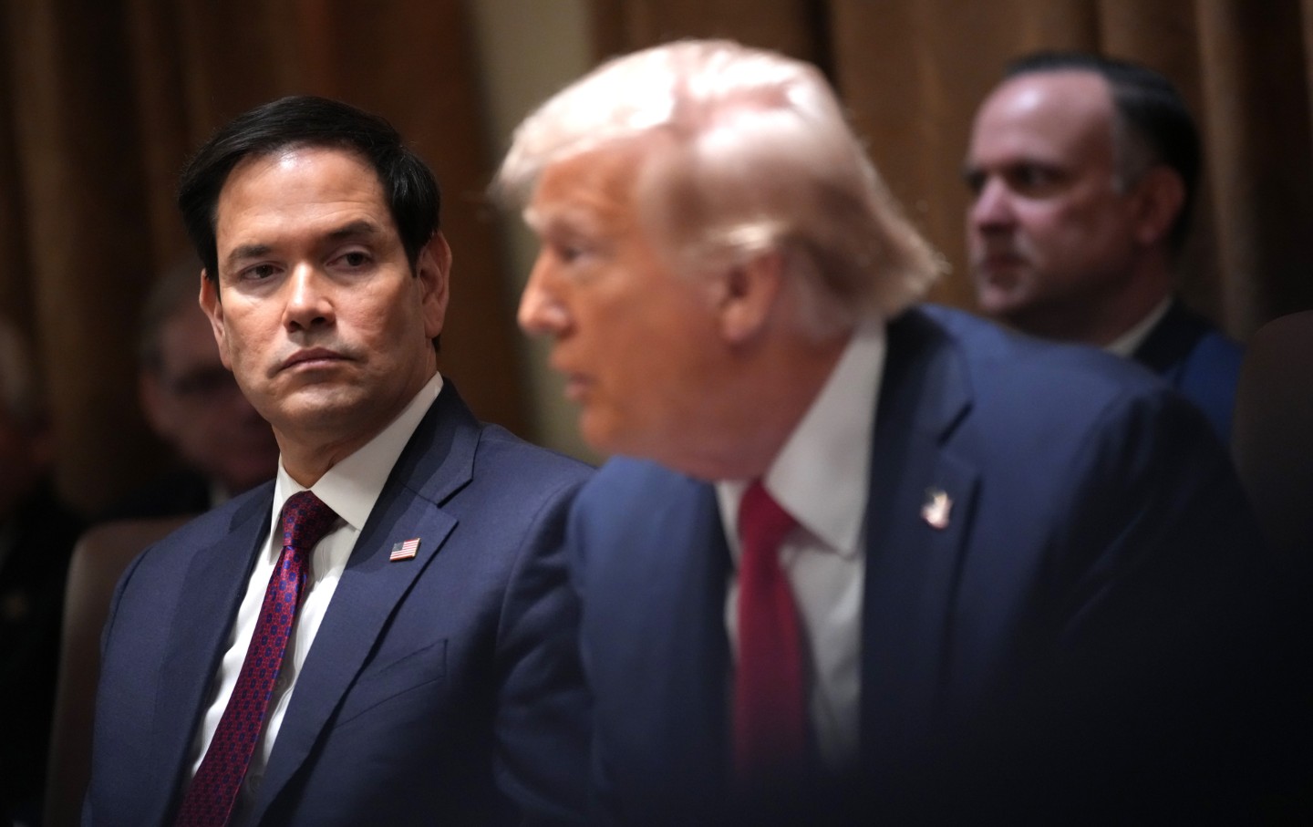 U.S. Secretary of State Marco Rubio listens as President Donald Trump delivers remarks during a Cabinet Meeting at the White House on February 26, 2025 in Washington, DC.