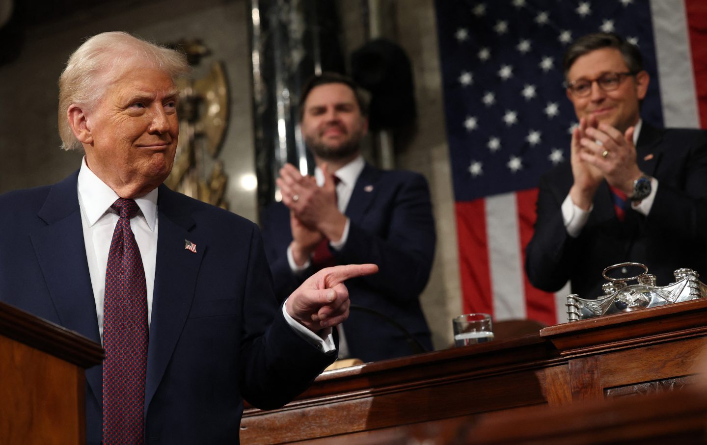 Vice President JD Vance and Speaker of the House Mike Johnson (R-LA) applaud as US President Donald Trump speaks during an address to a joint session of Congress in the House Chamber of the US Capitol in Washington, DC, on March 4, 2025.