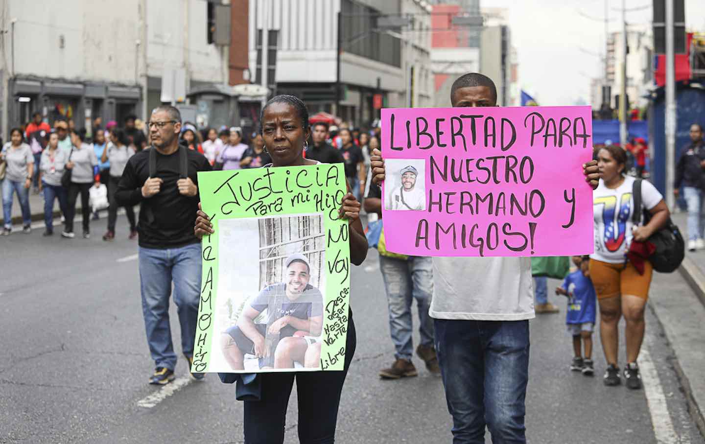 People stage a rally against the imprisonment of Venezuelans in a Salvadorian jail in Caracas.