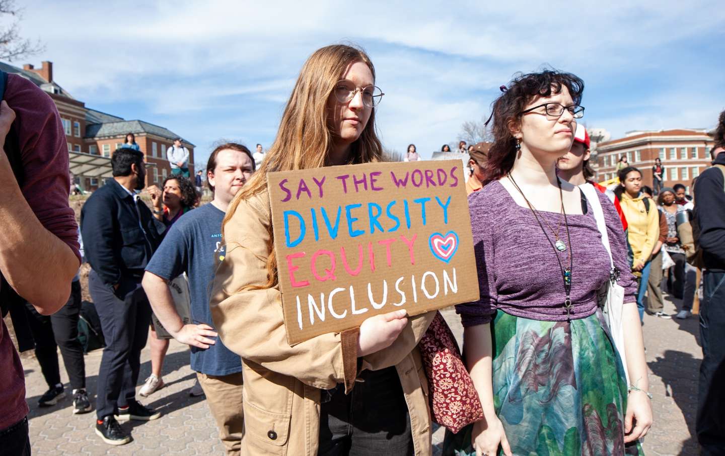 A student holds a sign during a pro-DEI protest at the University of Cincinnati's Bearcat Commons on March 4, 2025.