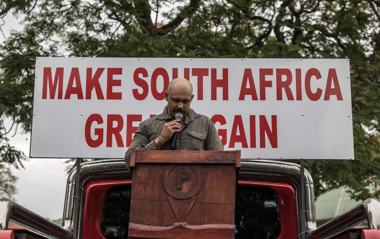 South African farmer Tewie Wessels addresses a group of white South Africans supporting US President Donald Trump and tech billionaire Elon Musk during a demonstration in Pretoria, on February 15, 2025.