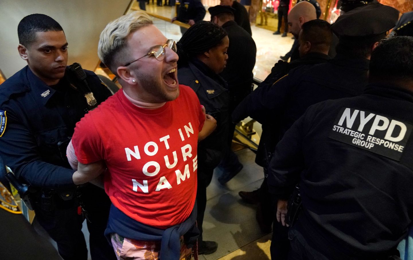 Demonstrators from the human rights organization Jewish Voice for Peace are detained by NYPD officers as they hold a civil disobedience action inside Trump Tower in New York on March 13, 2025.